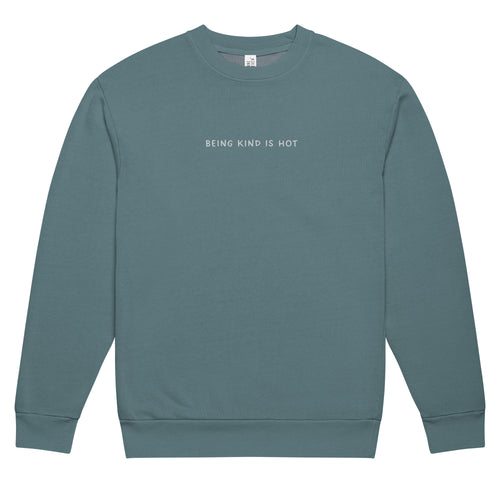 Teal sweatshirt with embroidered 'BEING KIND IS HOT' text on a white background