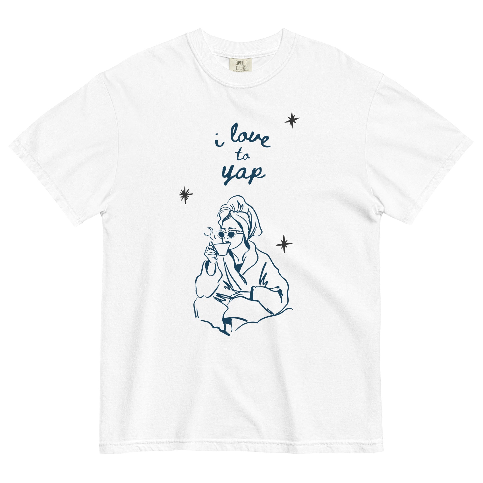 White t-shirt with a graphic of a girl in a robe and sunglasses, holding a mug, with 'i love to yap' text above.