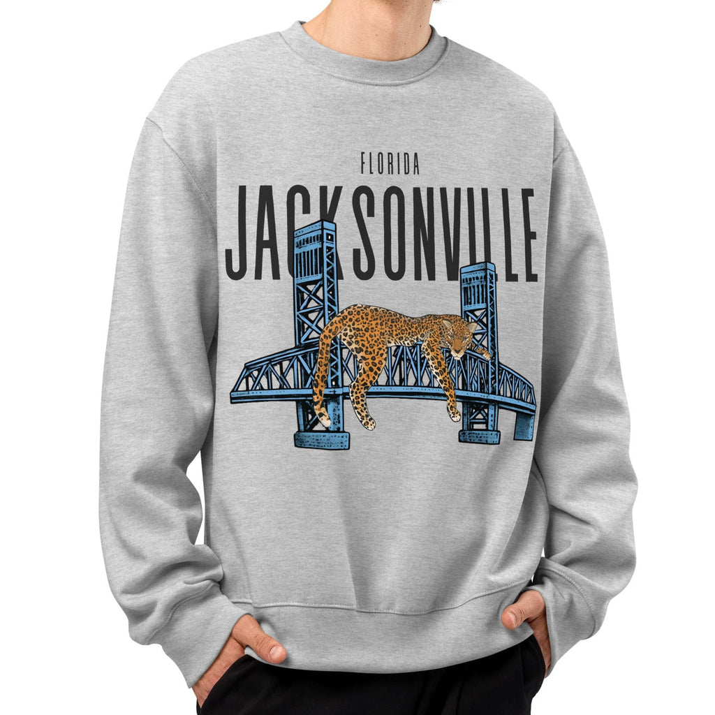 Person wearing a gray sweatshirt with Jacksonville design on a white background