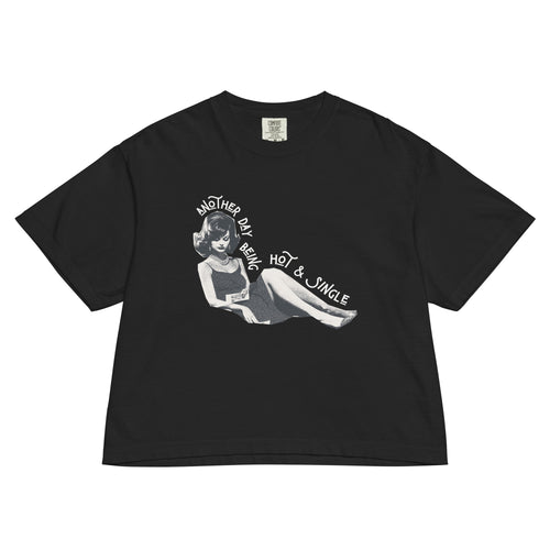 Black t-shirt with retro design of a woman and "another day being hot and single" text on a white background