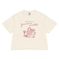 Beige t-shirt with red graphic and text 'meet me at the farmer's market' on a white background