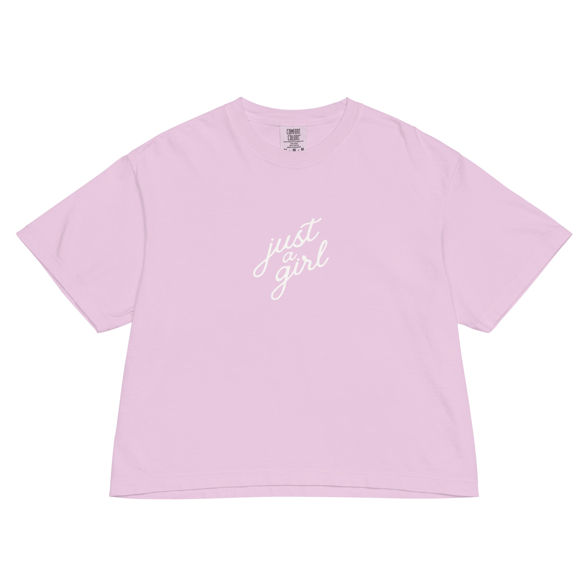 Pink t-shirt with 'just girl' text on a white background
