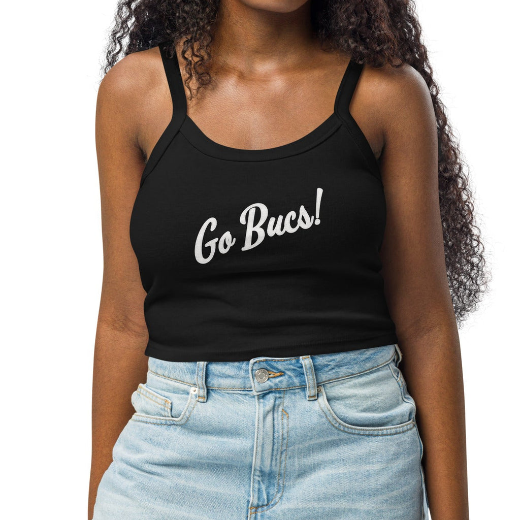 Woman wearing a black tank top with "Go Bucs!" text and denim shorts on a white background